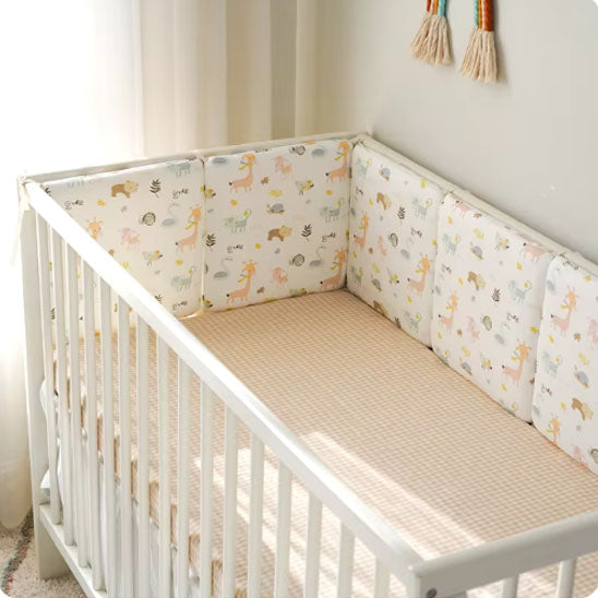 tour de lit beige berceau blanc